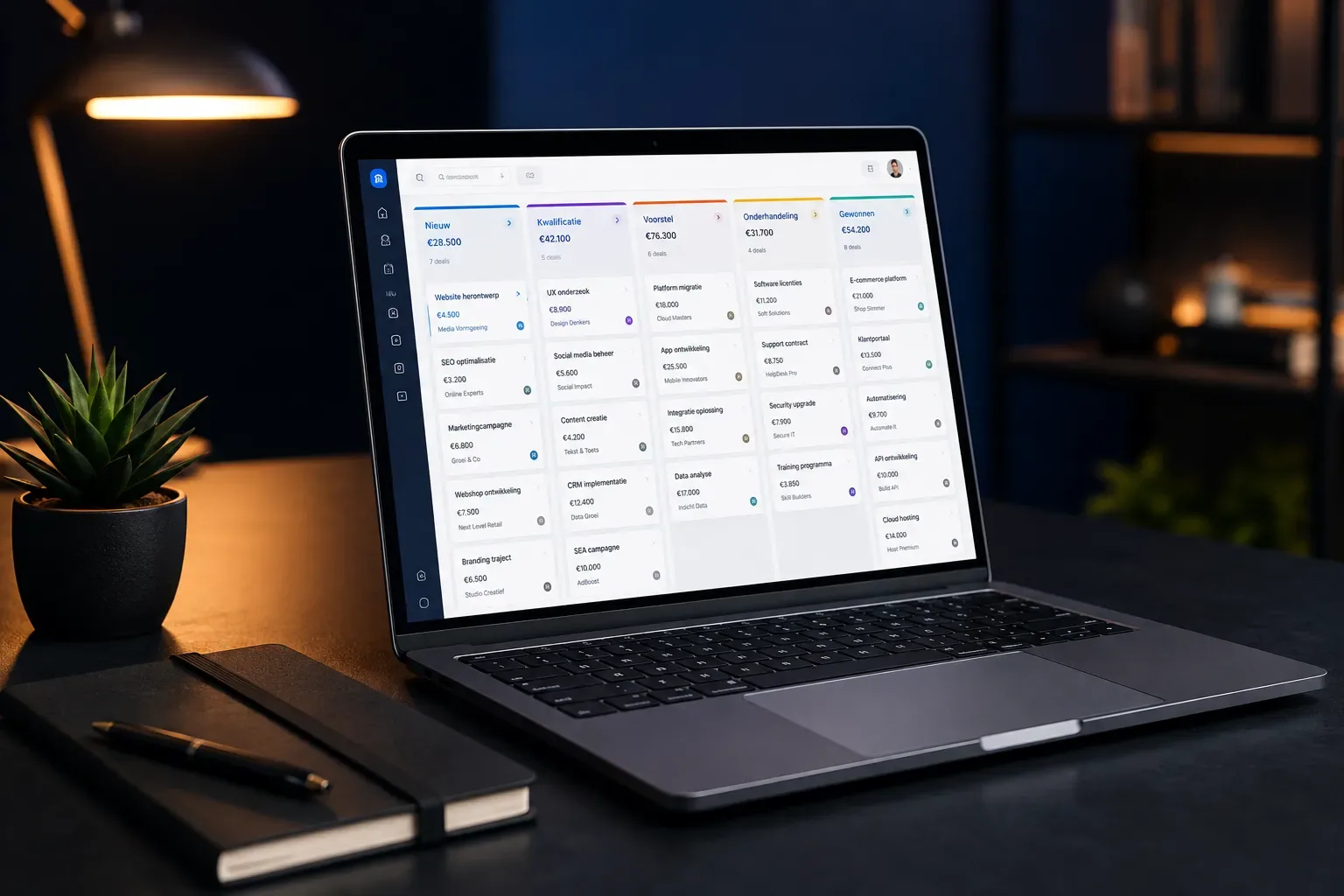 Studio product hero shot of a sleek laptop displaying a clean sales pipeline dashboard with colorful deal cards, placed on a